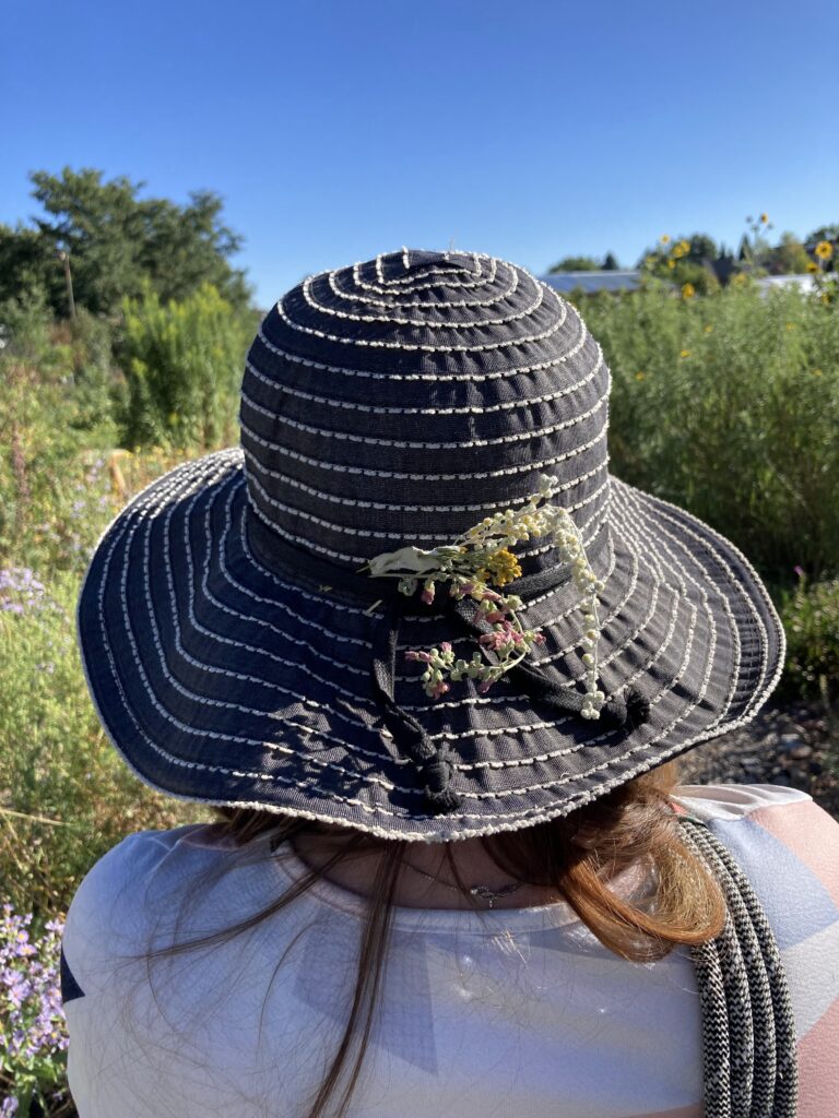Colorado native plants decorating a woman's hat